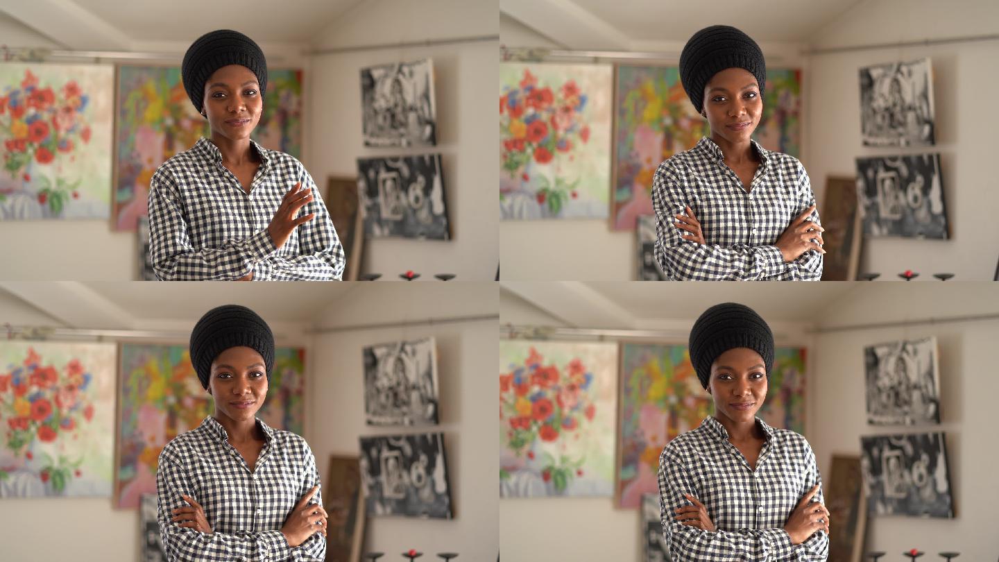 年轻的非裔美国女艺术家独自站在艺术工作室看着相机的4K视频肖像
