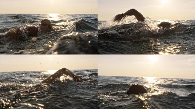 在波涛汹涌的大海中游泳的女子公开水域游泳运动员