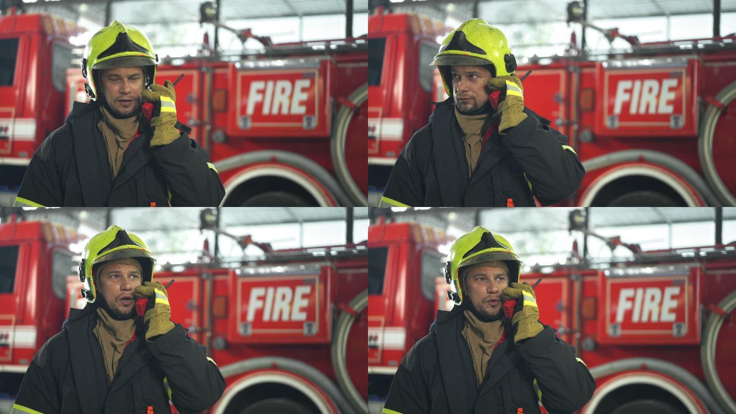 4K男消防员在消防站使用无线电工作