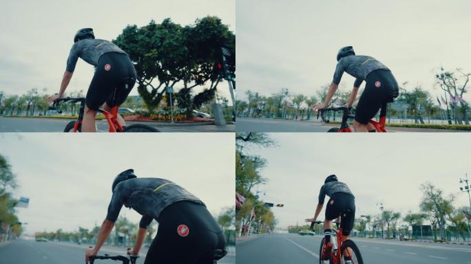 坚定的骑手在城市里骑着他的公路自行车。