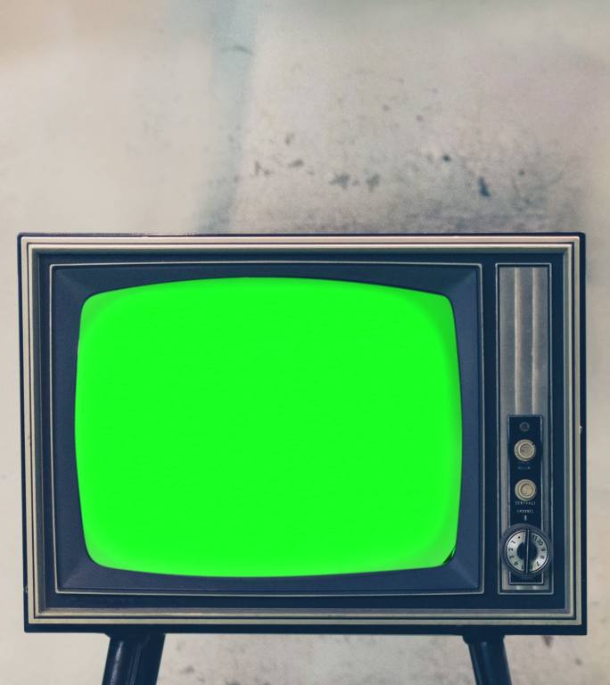 简陋房间内的复古电视，配有彩色按键屏幕