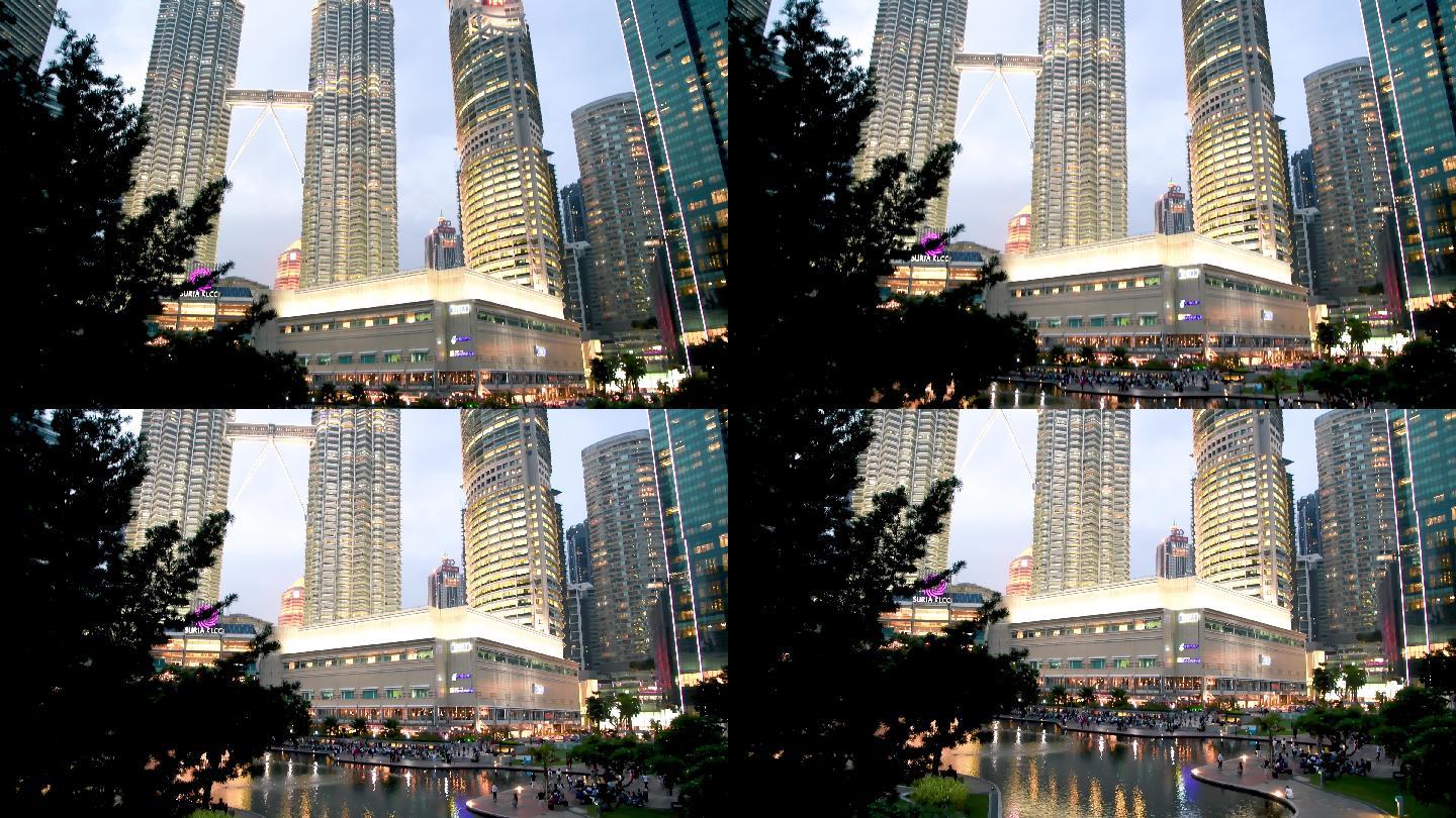 吉隆坡日落时分的马石油双塔和城市公园