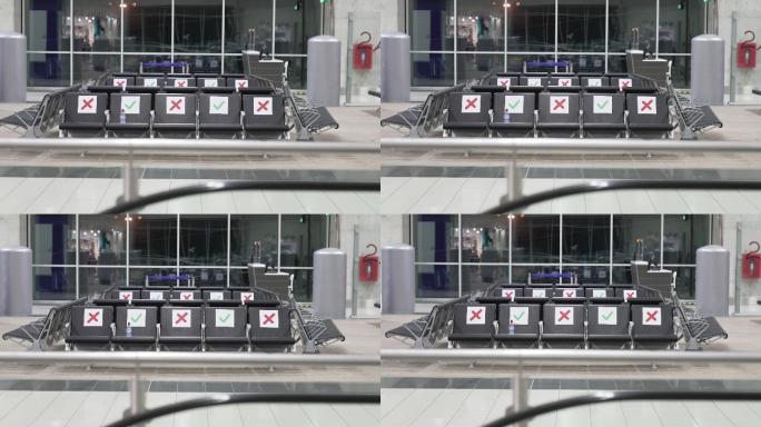 空旷的机场航站楼，有标记的座位，因此旅客可以跟随社交距离