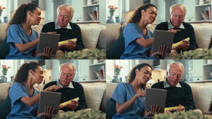 4k视频片段，一名女护士使用数字平板电脑向她的老年患者展示他的药盒