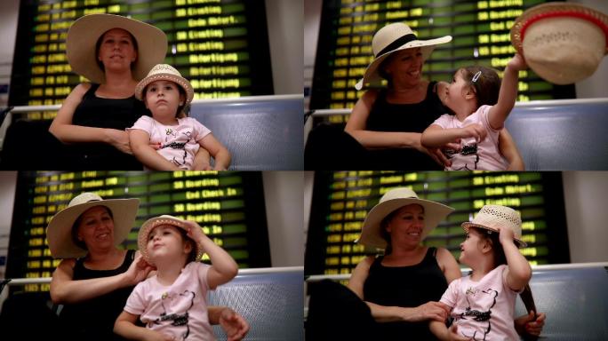 快乐的女儿和母亲在等飞机