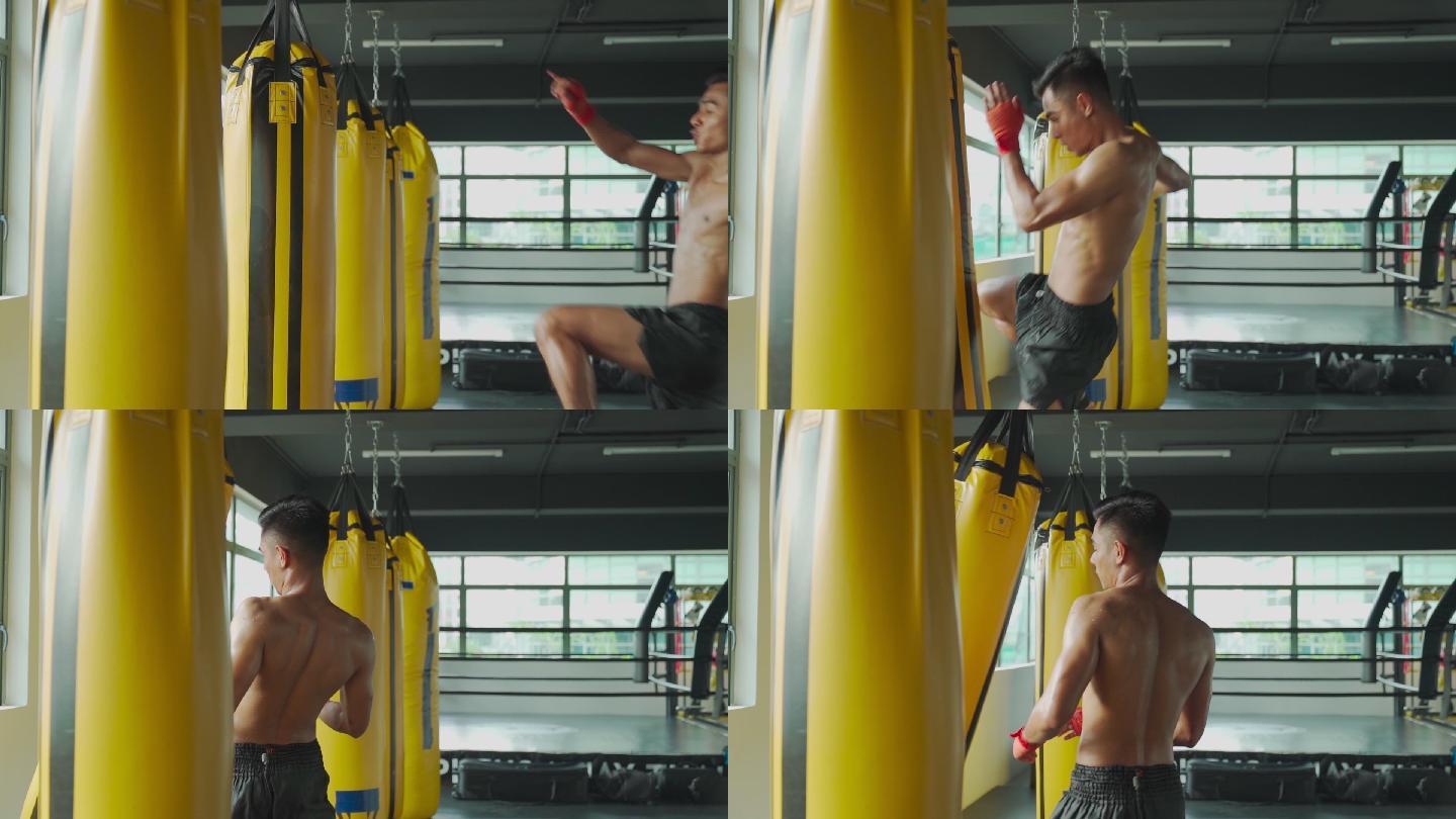 慢动作亚洲马来泰拳拳击手在健身房健身俱乐部飞踢拳击袋