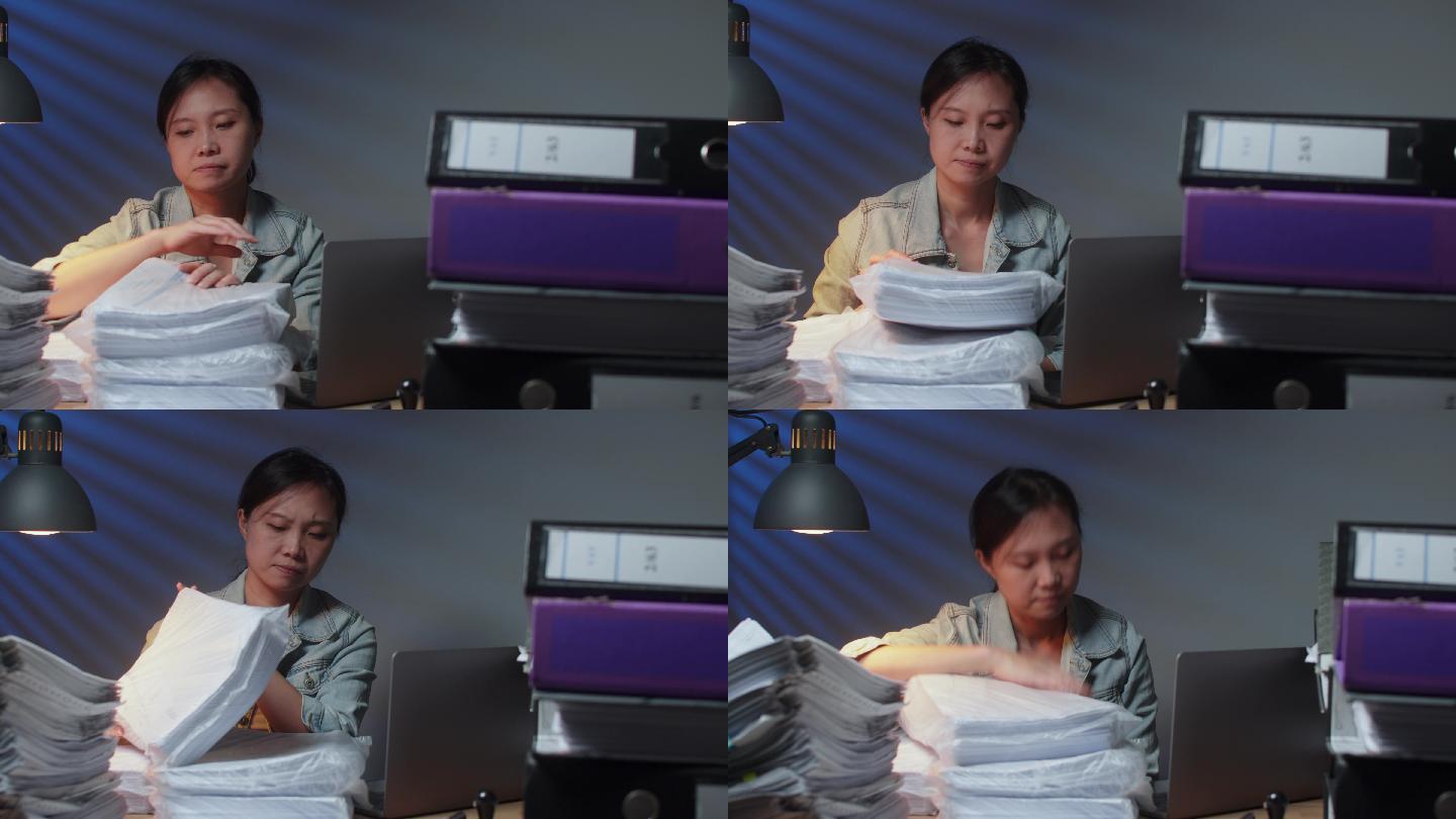 亚洲女性工作过度，睡在桌子上后感觉很累。