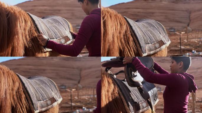 年轻的纳瓦霍族女孩备好马鞍准备骑马穿过纪念碑山谷