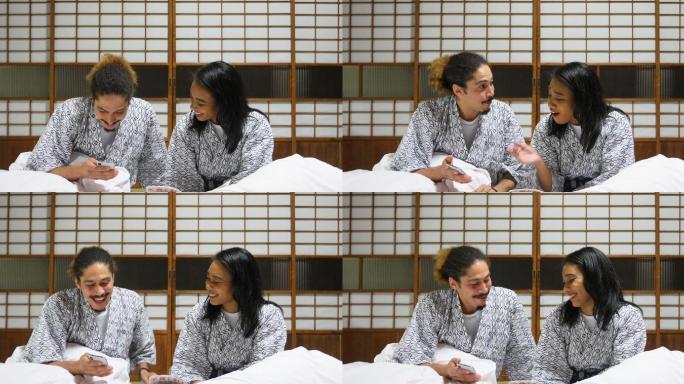 混血儿夫妇在日本蒲团床上看手机
