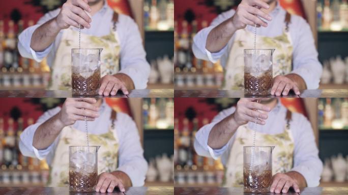 酒保在玻璃杯中摇动鸡尾酒的慢动作。