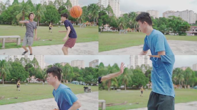 慢动作Z代亚裔中国少年在周末早上与朋友练习篮球比赛时投篮