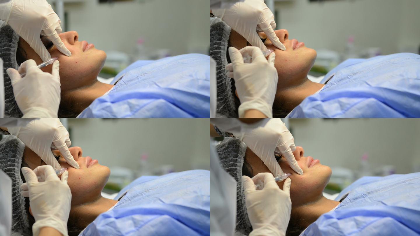 非手术面部皮肤矫正。正在注射肉毒杆菌素的年轻女子。女性美容师戴手套导致面部衰老