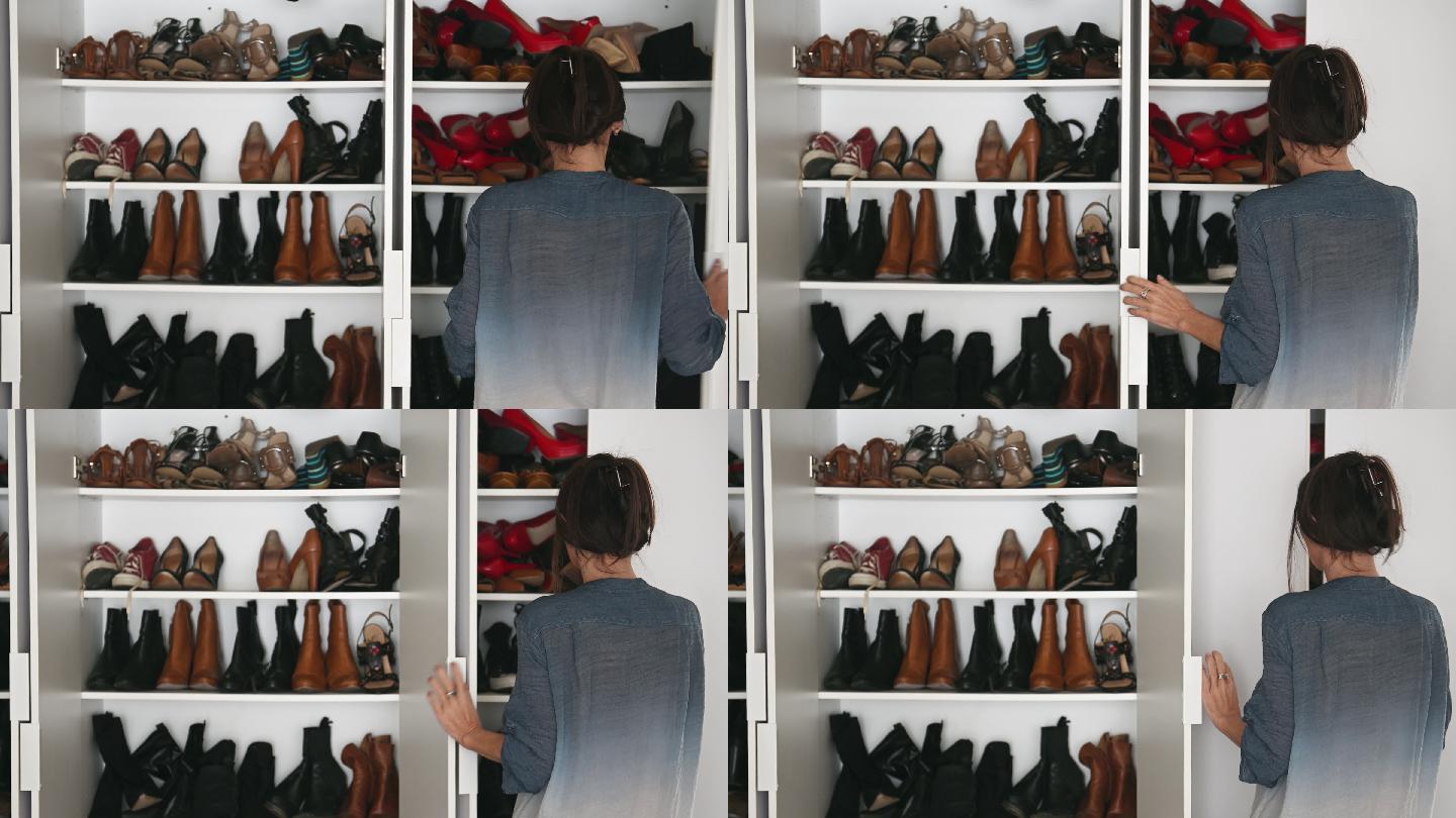 女人独自在大衣柜里整理许多鞋子