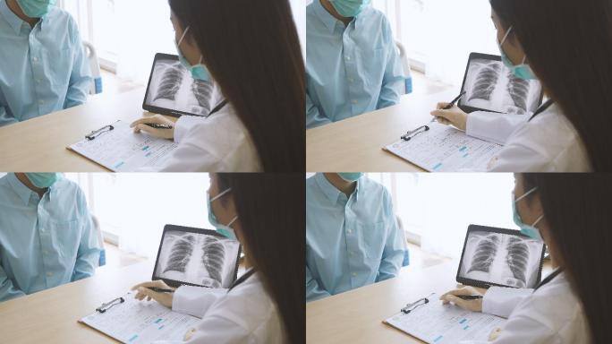 专业医生戴上口罩解释病人，并在笔记本电脑屏幕上显示肺部x光图像。医生穿着长袍在诊所病房与疑似感染冠状