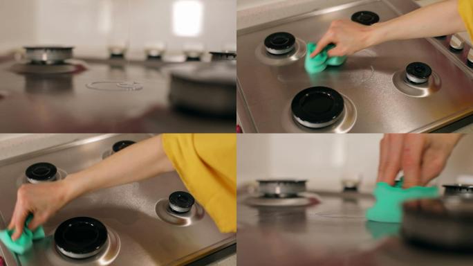 女性清洁和消毒厨房柜台、金属厨房水槽和自来水，女性手洗和清洁厨房中的煤气炉，调出脏厨房的焦点照片，用