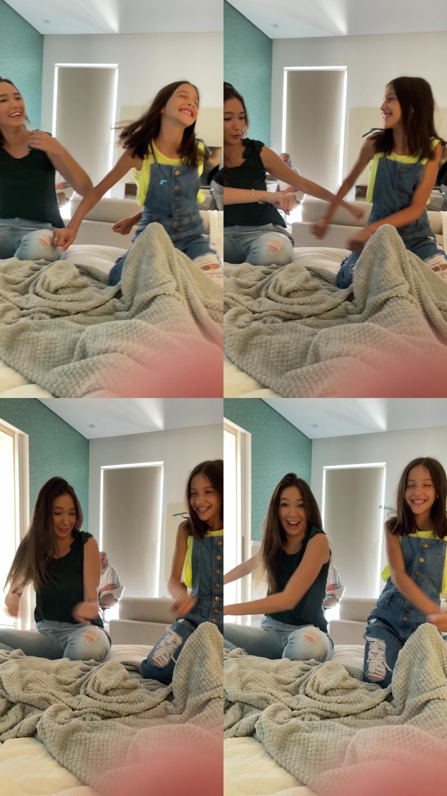 姐妹们在家里的床上跳舞-移动摄像头视角