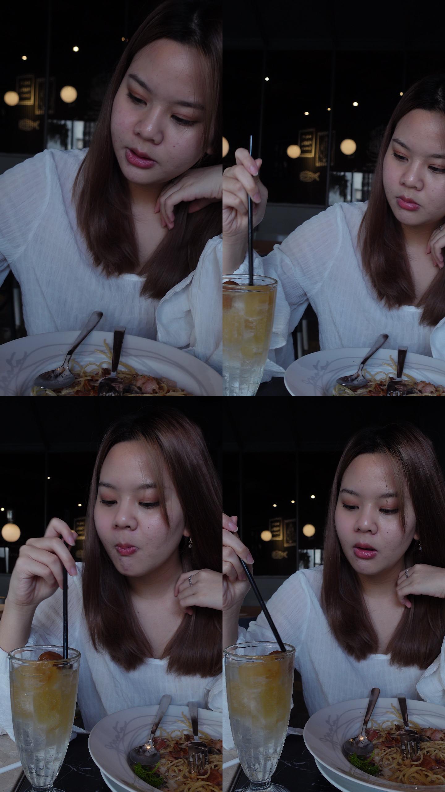 亚洲人少女在餐厅吃饭