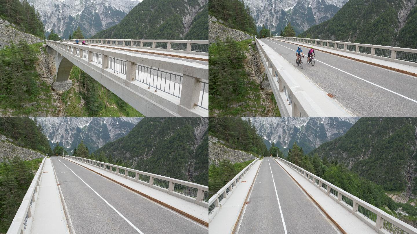 空中情侣公路自行车穿越山中一座漂亮的桥