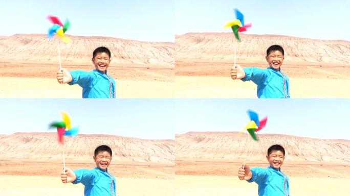吐鲁番火焰山亚洲男孩玩风车