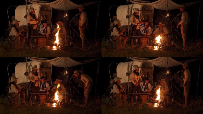 牛仔们聚集在篝火旁