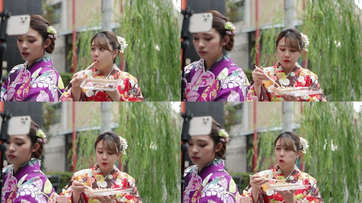 穿着和服的年轻女性朋友吃着takoyaki进行长腿运动