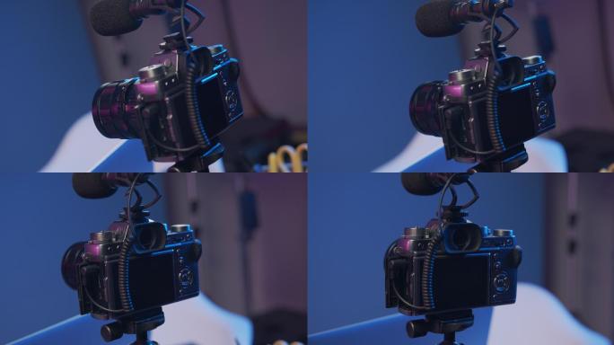 专业相机的特写视频，设置为在蓝色背景下拍摄