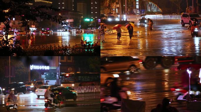 夜晚雨后十字路口的行人和车流