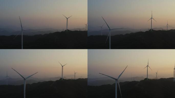 4K航拍夕阳下运转的风力发电机