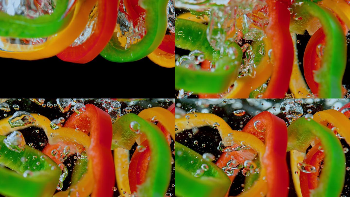 五颜六色的甜椒片掉进水中