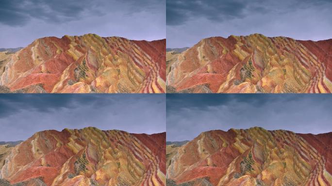 在中国甘肃张掖丹霞国家地质公园拍摄的移动云的时间点电影。五彩缤纷的彩虹山景观