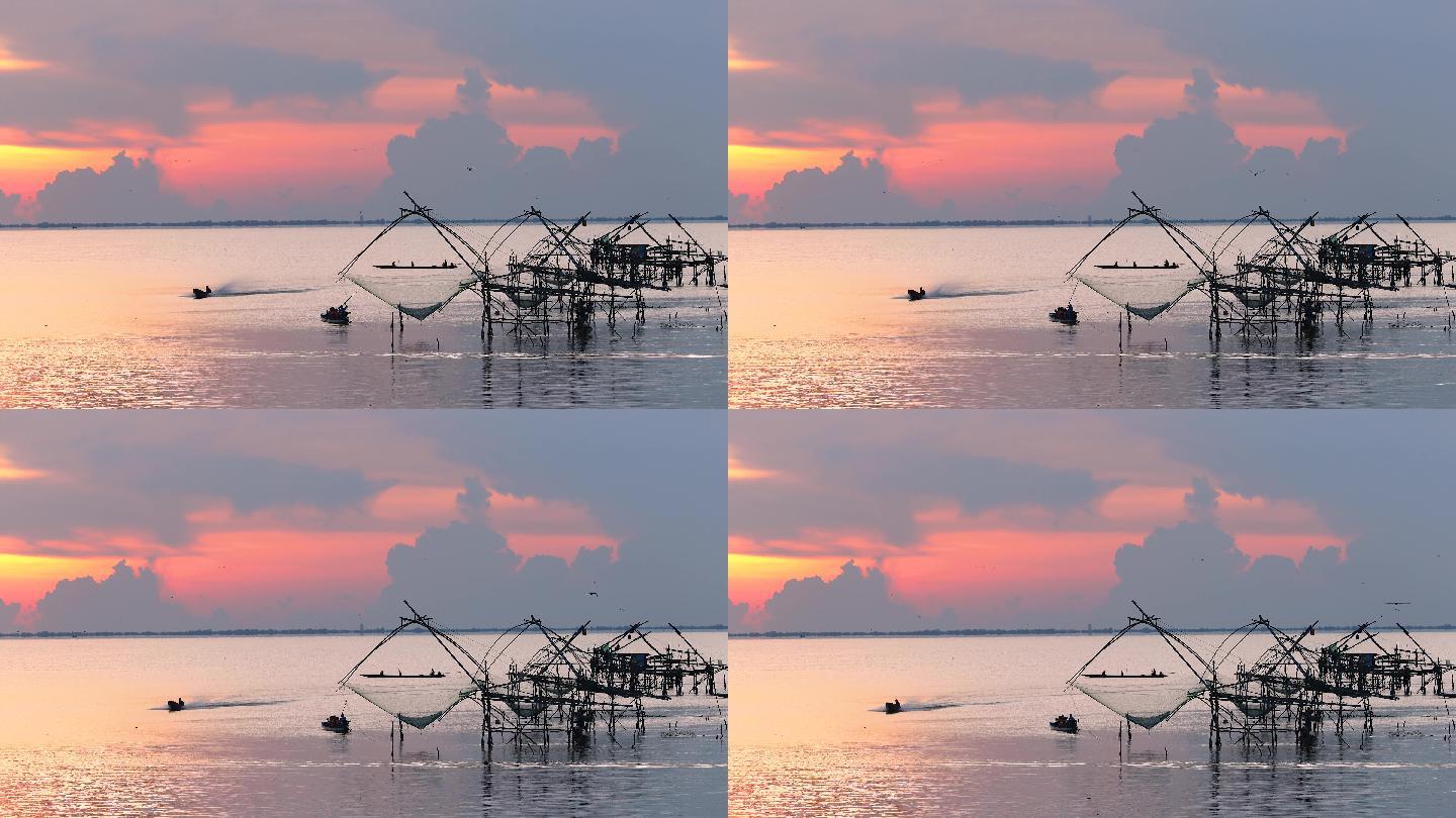 水产养殖。日出时分，泰国法塔隆区Pak Pha，当地渔网在湖泊或河流中的自然景观，游客和渔民