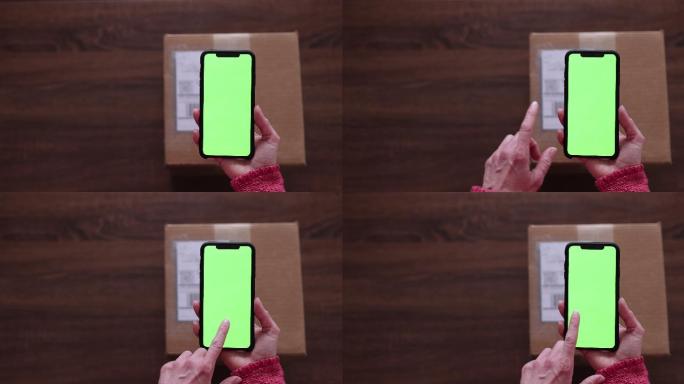 女性手持chroma键绿色屏幕手机扫描标签并退回包裹的特写镜头
