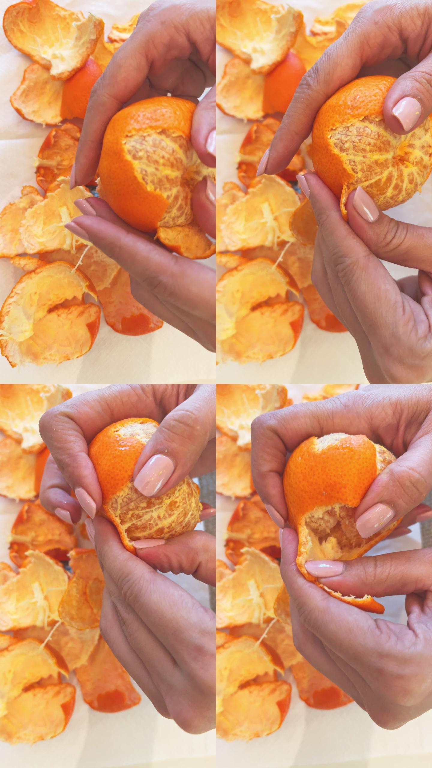 剥鲜橘子的女人撕桔子皮