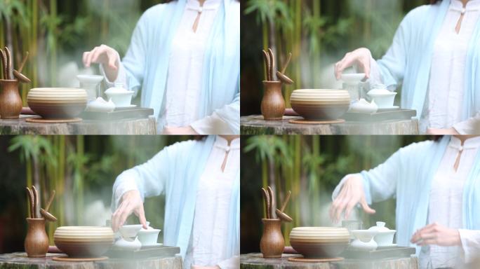 美女倒茶沏茶茶艺师泡茶煮茶开水洗杯倒茶