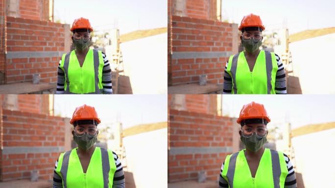 一名女性建筑工人在施工现场使用防护面罩的肖像