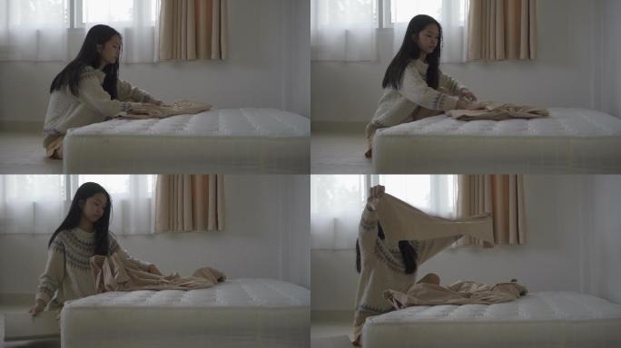 亚洲女人铺床单单身公寓