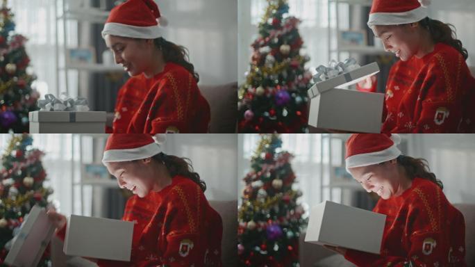 圣诞快乐亚洲女人在家打开礼品盒