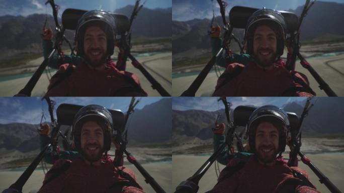 巴基斯坦北部卡特帕纳沙漠上空的男子副驾驶自拍