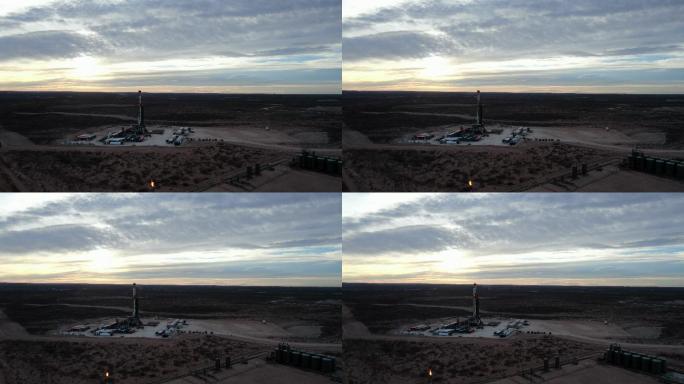 新墨西哥州太阳升起时，无人机俯瞰石油或天然气钻井压裂井场