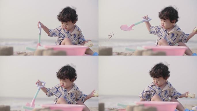 海滩上的可爱男孩孩子玩耍