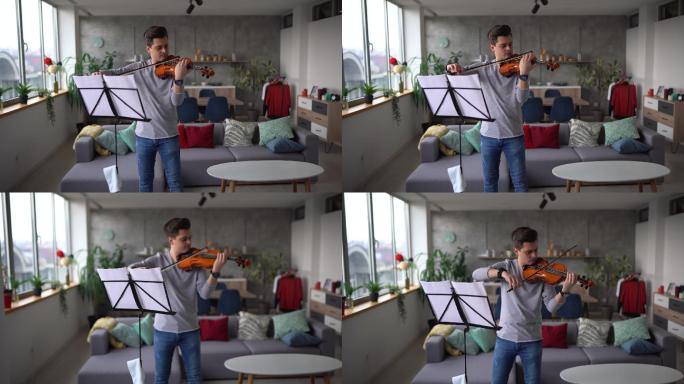 男小提琴家在客厅排练乐曲