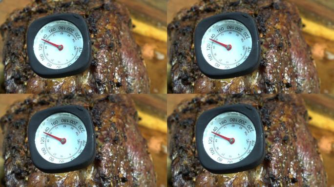 在140度的温度下，一根肋骨上的肉温度计。