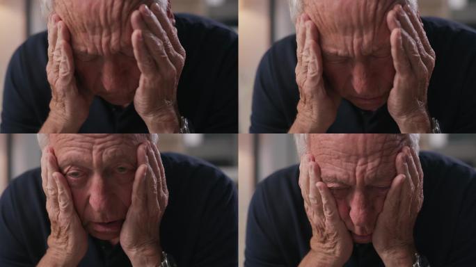 一名老人独自坐在家中头痛的4k视频片段