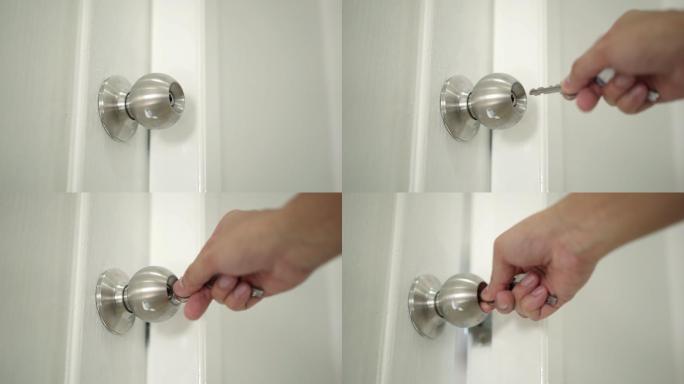 男人的手用钥匙开锁，家里的门