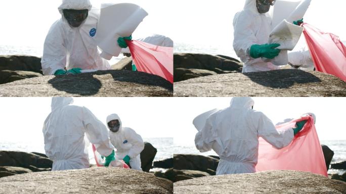 污染控制团队PPE套装致力于清理海滩溢油补贴