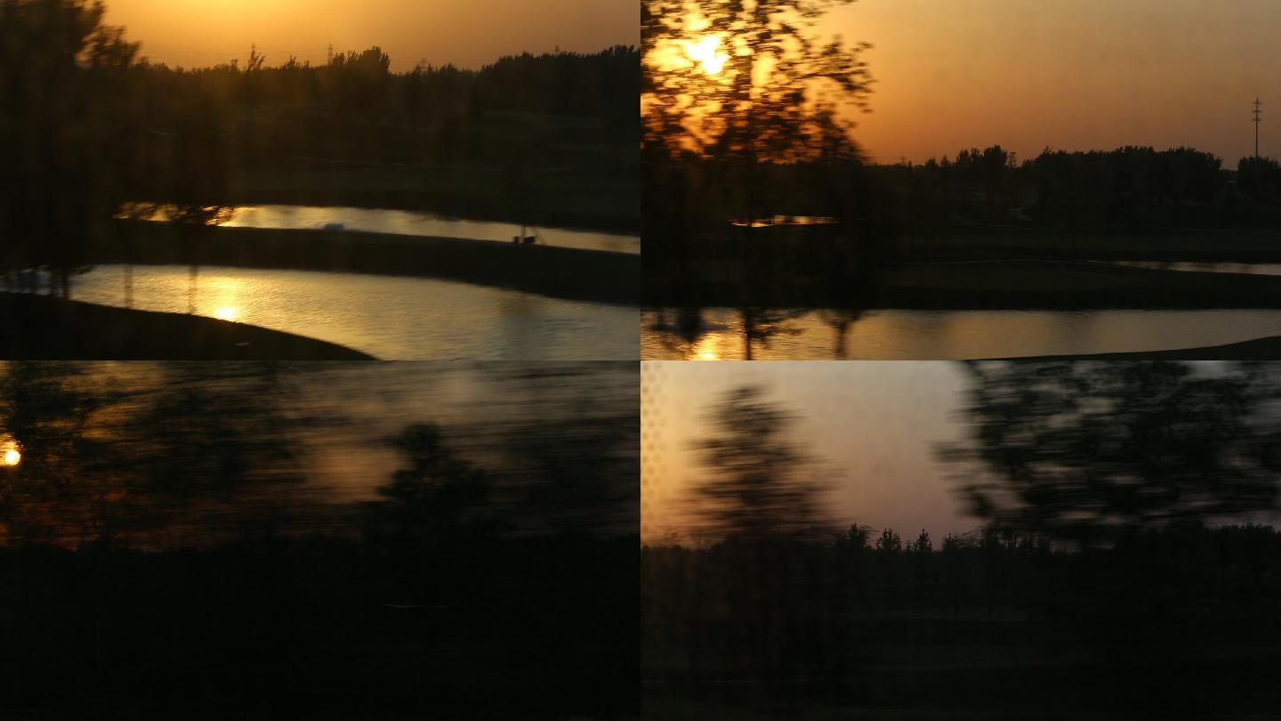 高铁上火车上窗外夕阳黄昏日落列车沿途风景