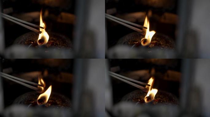 特写镜头：泰国佛寺的油灯和蜡烛上燃烧的4K圣火。