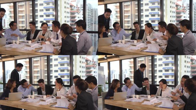 亚洲经理在现代工作场所会面时为亚洲商人提供指导，pan shot