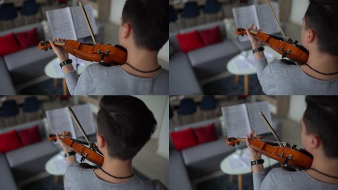 男小提琴家排练乐曲