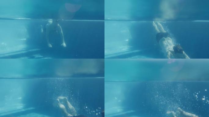 泳池中的情侣潜泳
